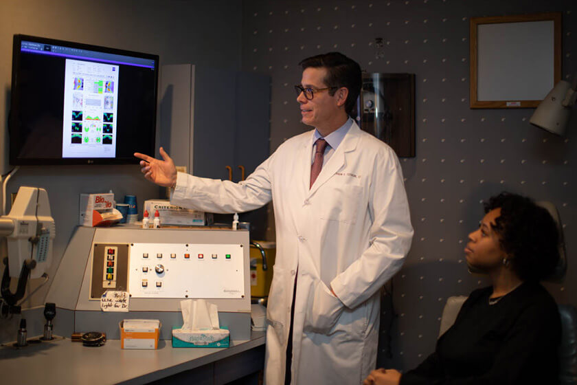 Doctor and Patient Going Over Glaucoma Scans