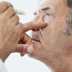 Man having his eye examined