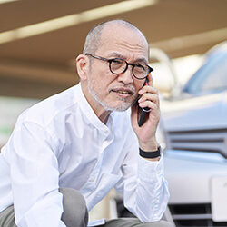 Man on the phone after a traffic accident